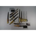 Nine various replica daggers including Franklin Mint examples