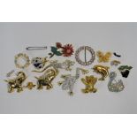 A collection of gilt-metal costume jewellery brooches