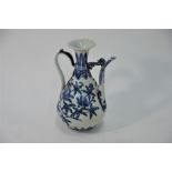 A Chinese Ming style blue and white ewer, Yongle mark but not of the period, 27 cm high
