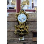 A reproduction French floral decorated black lacquer and gilt brass mounted bracket clock by Paul B,