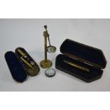 A 19th century cased brass pocket microscope