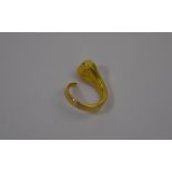 A yellow metal ring in the form of a stylised serpent
