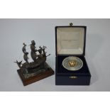 A silver Christmas musical box and Mary Rose model