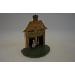 A vintage novelty wooden 'Weather House' collectable by 'Kendella'