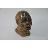 An African carved stone head sculpture