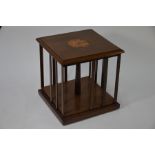 An inlaid walnut table-top revolving bookcase, 20th century