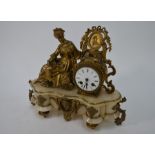 A late 19th century gilt-metal mounted alabaster drum mantel clock