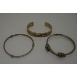 Three various white metal bangles