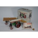 A boxed Mamod Steam Tractor and lumber wagon,