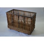 A vintage steel framed wicker and stick laundry trolley