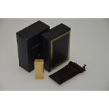 Dunhill - A 9ct yellow gold cigarette lighter of brick form