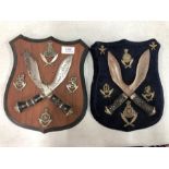 Two pairs of mounted kukri and badges (2)