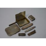 A silver cigarette case and other silver smoking accessories