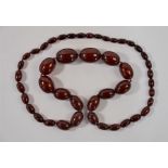 A cherry red graduated amber necklace