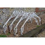 Four antique white painted wrought iron conservatory 'A' frame ridge brackets