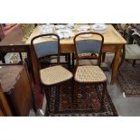 A pair of mahogany cane seated side chairs