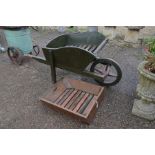 Antique green painted wooden wheelbarrow