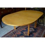 A modern beech oval dining table to/w oak occasional table
