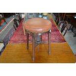 Revolving piano stool with studded leather upholstery