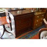 A reproduction mahogany chest of drawers