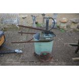A vintage iron and galvanized steel garden trolley sprayer