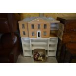 A Georgian country mansion style ochre painted two storey doll's house