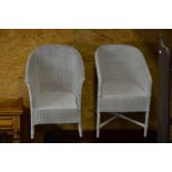 Two white painted Lloyd Loom style wicker tub chairs