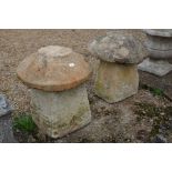 Two staddle stones (reduced height) with weathered cast tops