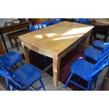 A modern light oak extending dining table