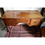 A Victorian mahogany sideboard with shaped frieze fitted with three drawers