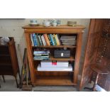 A mahogany open bookcase with three shelves