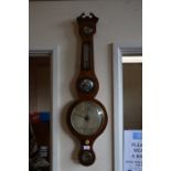 A mahogany wheel barometer/thermometer