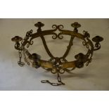 A large circular gilt metal six sconce chandelier, hanging on three chains