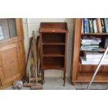 A small stained pine open bookcase with two shelves