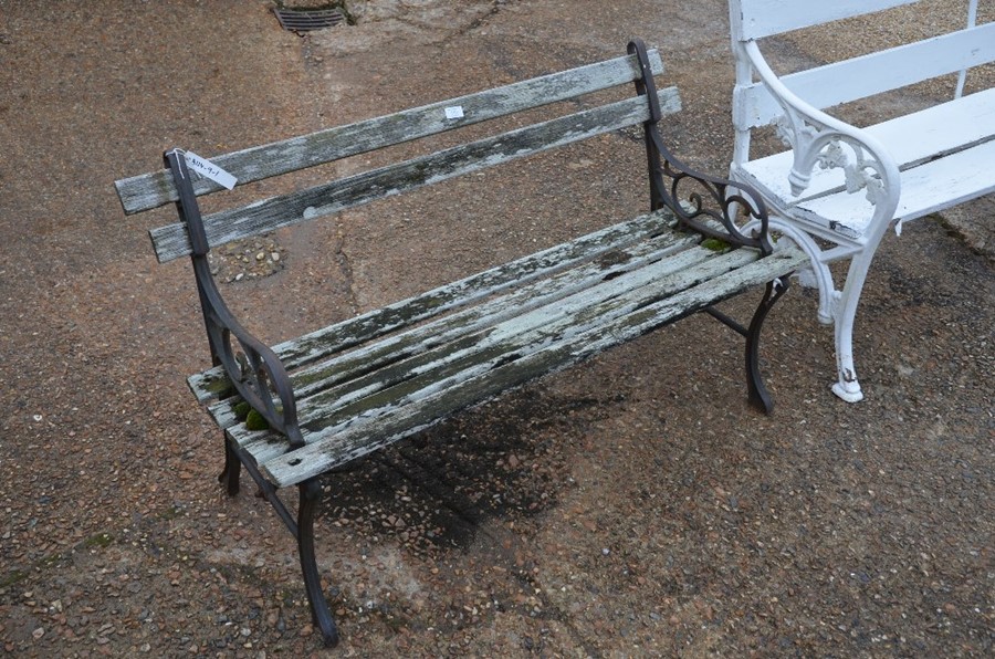 Victorian style cast metal and weathered slatted teak garden bench