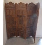 An Indian hardwood four-panel folding screen