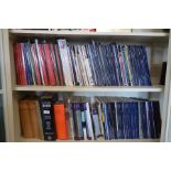 Two shelves of auction catalogues