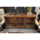 A contemporary hardwood and gilt metal framed sideboard/display cabinet