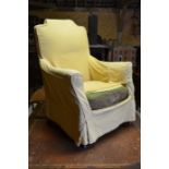 Victorian mahogany framed upholstered armchair with loose yellow cover