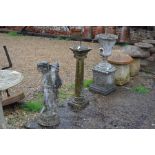 A weathered stone garden urn on square plinth to/w