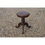 A Victorian rosewood revolving piano stool