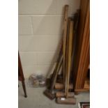 An assortment of vintage croquet mallets, balls, peg