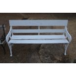 An antique white painted cast iron and slatted teak garden bench