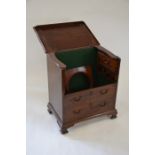A mahogany dummy drawer front chest commode on bracket feet