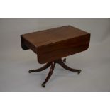 A 19th century mahogany sofa table, the drop leaf
