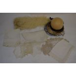 A mixed box to include table linen, ostrich plume, embroidered silk panel etc.