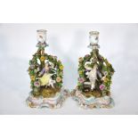 A pair of 19th century Meissen porcelain chamberstick groups