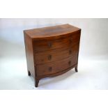 A 19th century mahogany bow-front chest of three long graduated drawers