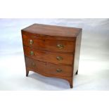A George III cross-banded mahogany bowfront chest of three drawers