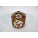 An 18th century Chinese famille rose and cafe au lait jar and cover, Qing